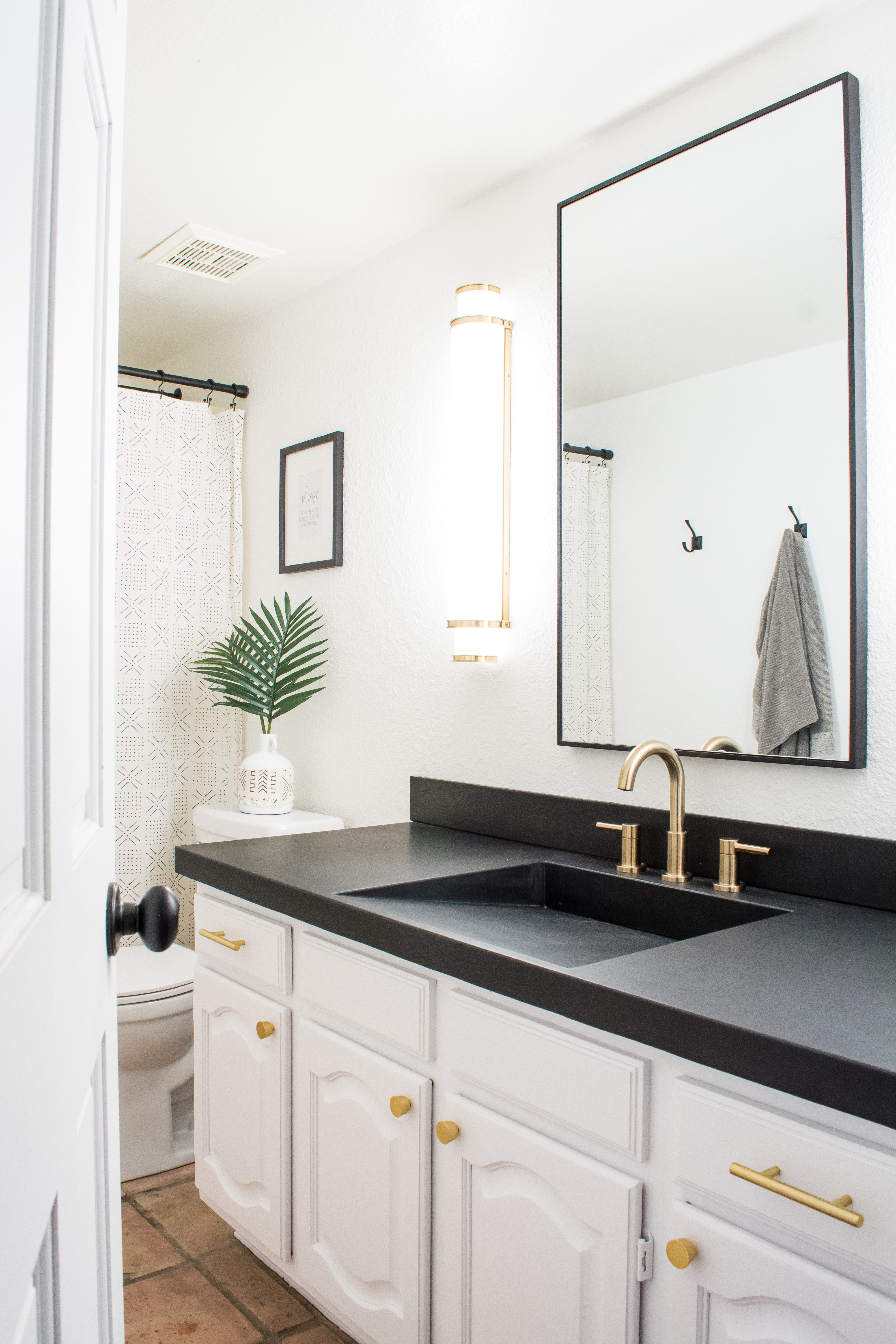 Easy DIY Builder Grade Bathroom Update | Part II: The Design Process, Brass Faucet, Brass hardware, Black framed mirror, white walls