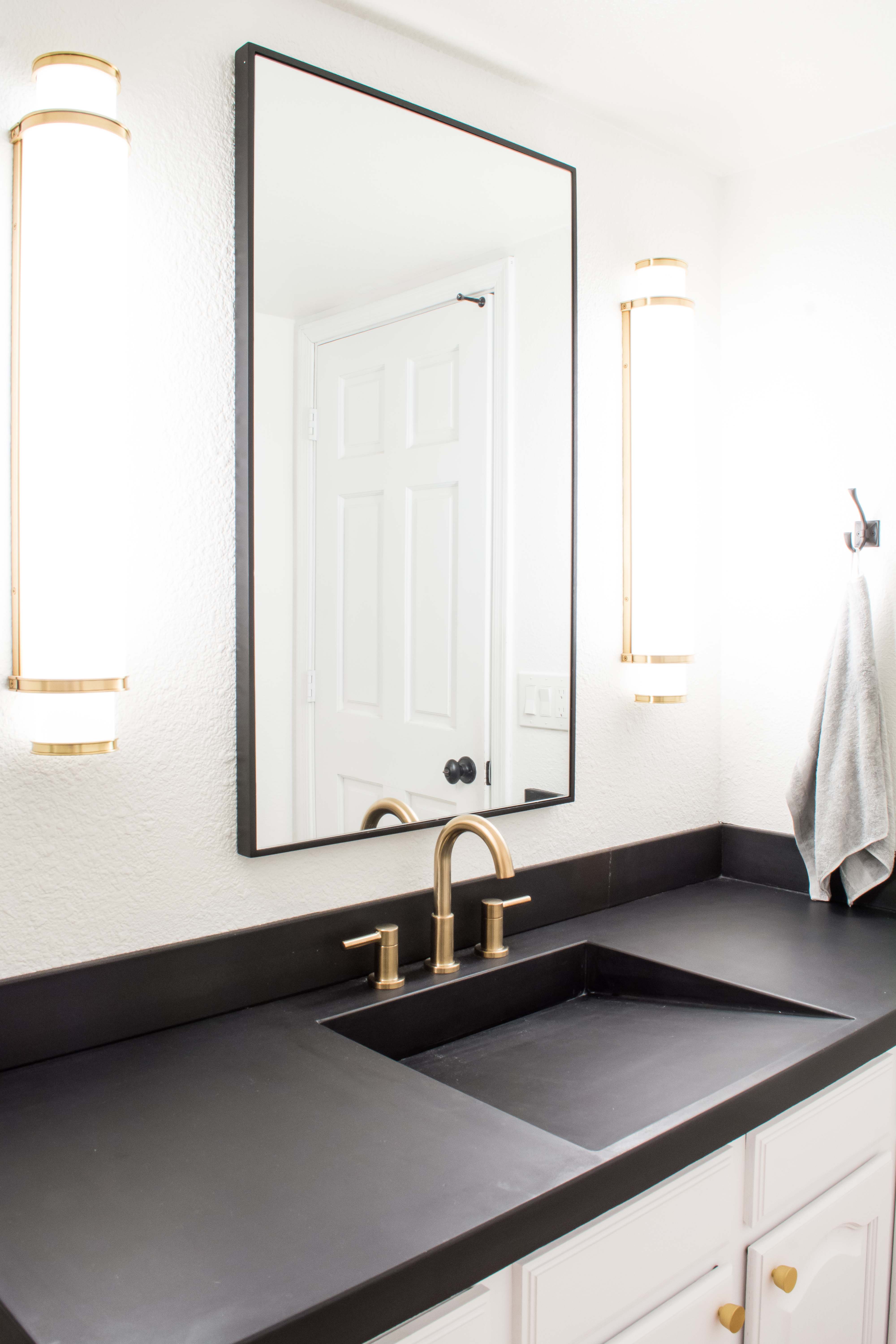 Easy DIY Builder Grade Bathroom Update | Part II: The Design Process, Brass Faucet, Brass hardware, Black framed mirror, white walls