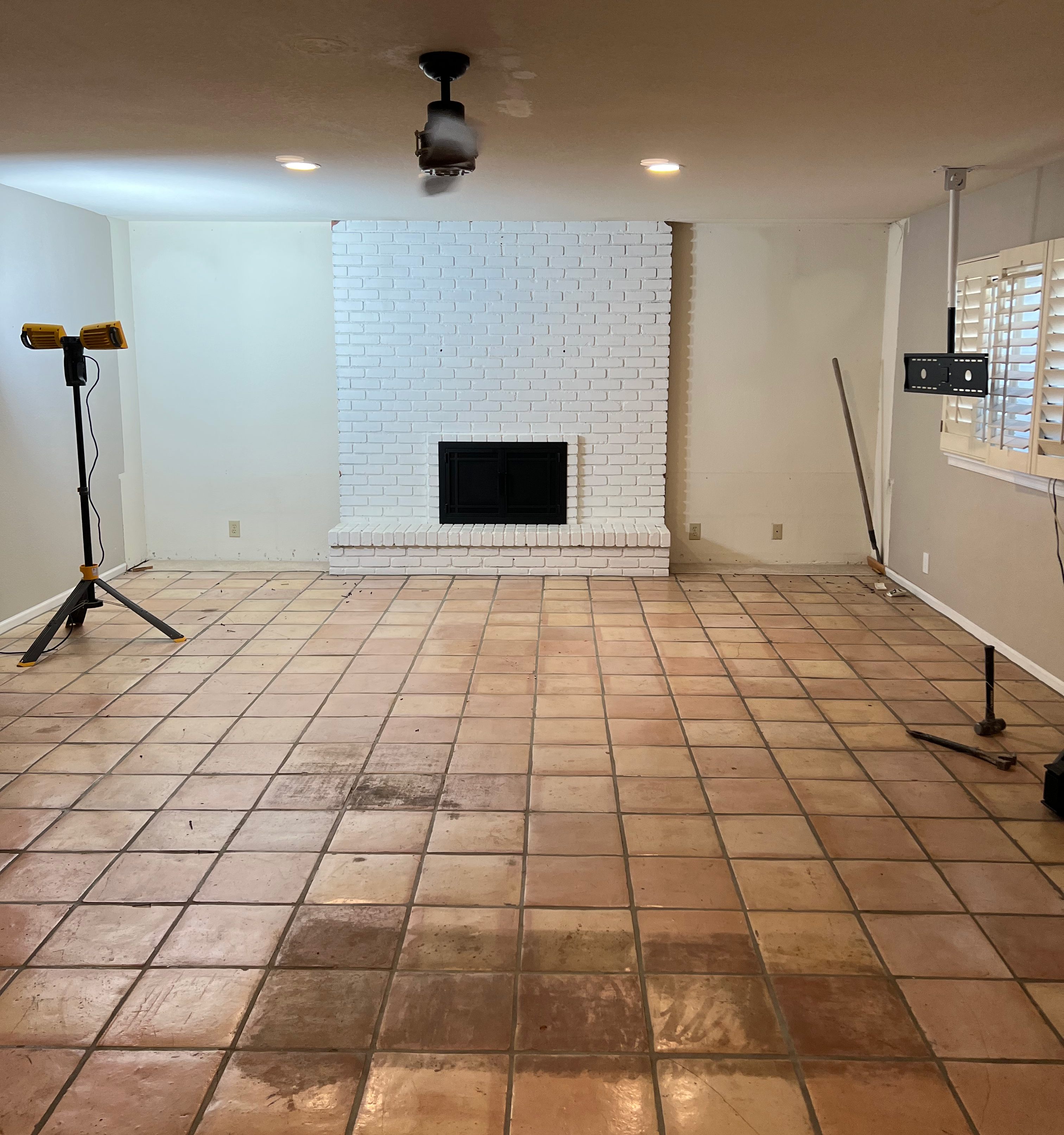saltillo and white brick fireplace before remodel